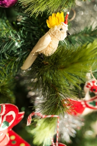 cockatoo and santa hat decoration on a christmas tree