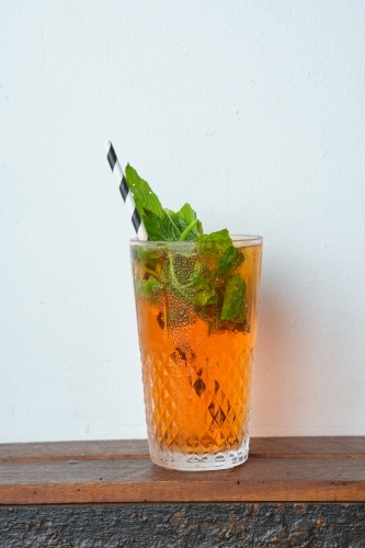 cocktail with crushed ice, and fresh mint. - Australian Stock Image