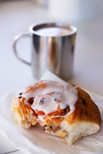 Coffee and fruit bun - Australian Stock Image