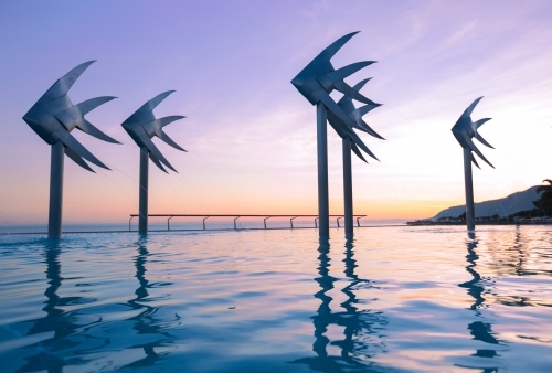 Colourful skies at sunrise over Cairns Lagoon - Australian Stock Image
