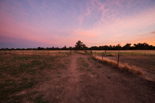 Colourful sunrise landscape of farming paddocks - Australian Stock Image