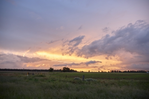 Colourful sunset over farmland - Australian Stock Image