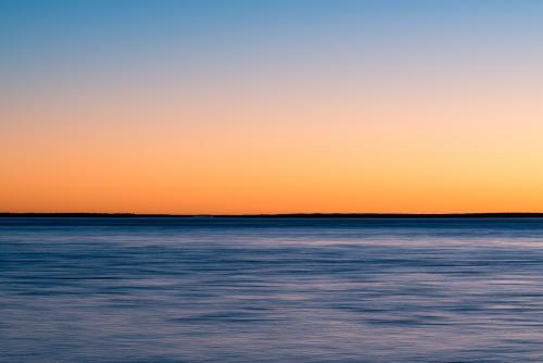 Colourful sunset over water