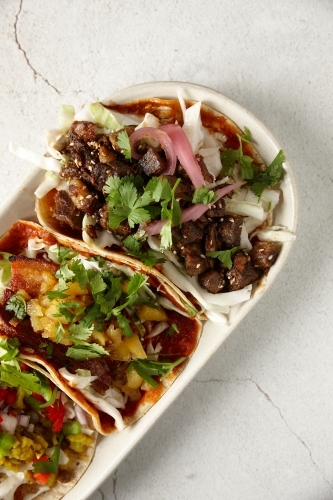 Colourful variety of meat tortillas on plate - Australian Stock Image