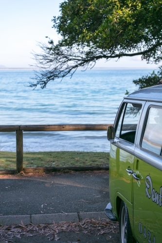Combi van parked in front of surf spot at Noosa Heads - Australian Stock Image