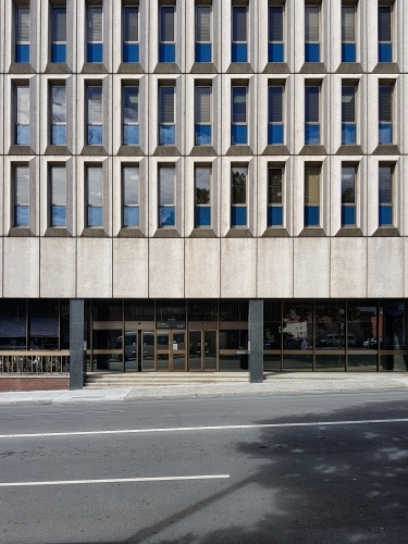 Concrete building facade with windows - Australian Stock Image