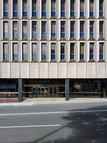 Concrete building facade with windows