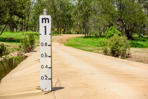 Concrete flood way with water level gauge in Queensland, Australia - Australian Stock Image