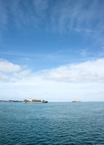 Container ships passing each other at the heads - Australian Stock Image