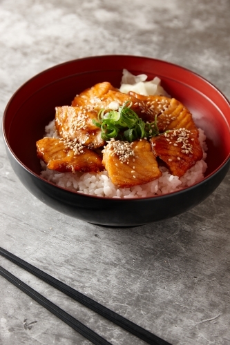 Cooked salmon noodle dish in bowl - Australian Stock Image