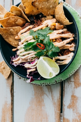 Corn chips and Mexican style food in a bowl