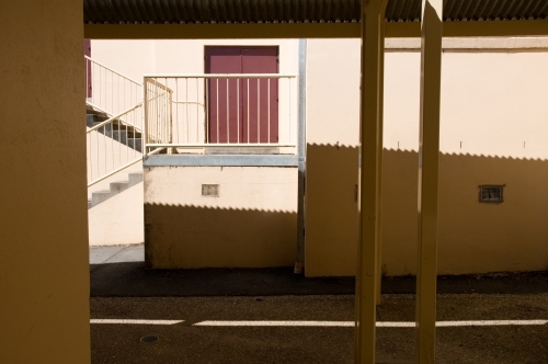 Corrugated iron roof shadows on a building - Australian Stock Image