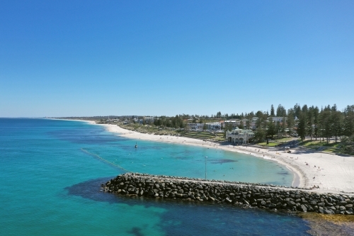 Cottesloe Beach in the early morning on a clear day in summer.