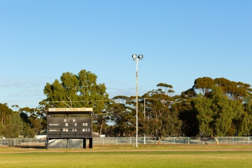 country football oval with scoreboard - Australian Stock Image