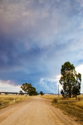 Country road leading towards bushfire smoke - Australian Stock Image