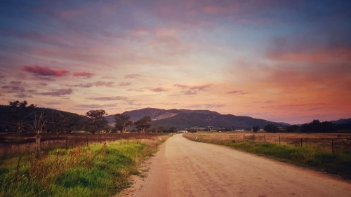 Country road sunset with pink sky - Australian Stock Image