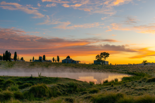 Country silhouettes and a colourful dawn sky - Australian Stock Image