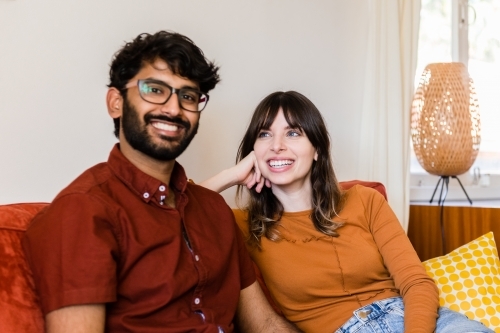 couple at home in living room - Australian Stock Image