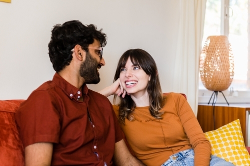 couple at home in living room - Australian Stock Image