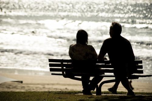Couple relax on chair at the beach