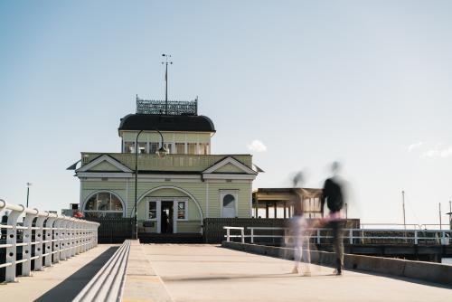 Couple Walking on St Kilda Pier - Australian Stock Image