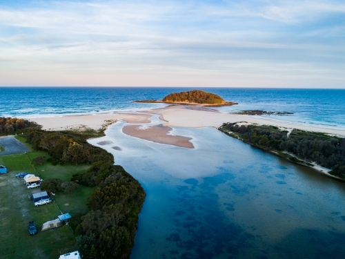 Crampton Island and the outlet of Tabourie creek at dusk - Australian Stock Image