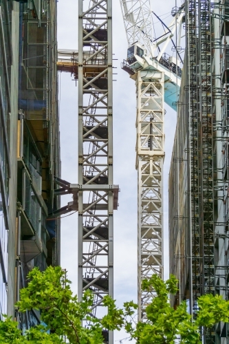 Crane scaffolding between two buildings under construction - Australian Stock Image