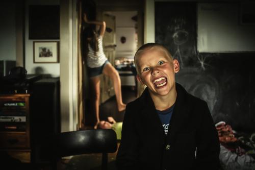 Crazed siblings at home - Australian Stock Image