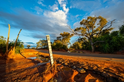 Creek crossing with water level sign - Australian Stock Image