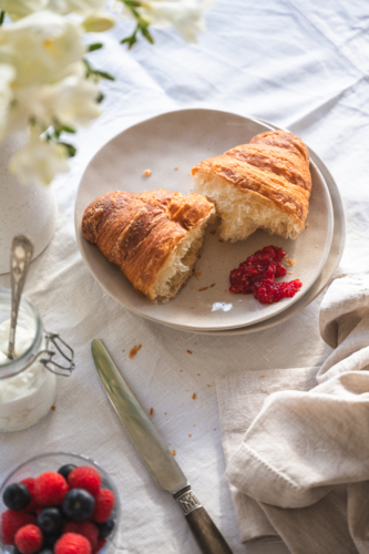croissant and berries for breakfast - Australian Stock Image