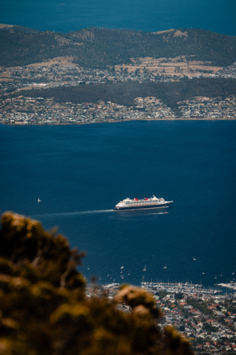 Cruise ship sailing through the deep blue ocean Tasmania, Australia - Australian Stock Image