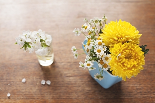 Cute bunches of flowers on table top in spring