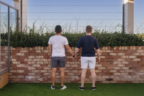 cute gay couple holding hands