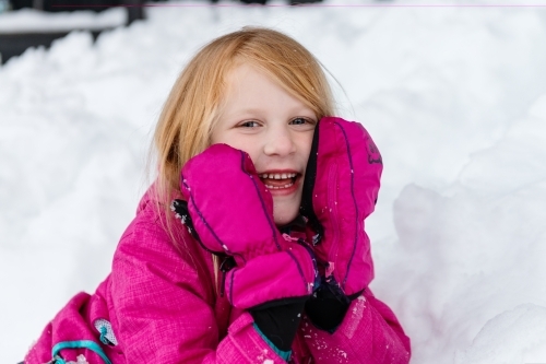 cute red head girl in the snow - Australian Stock Image