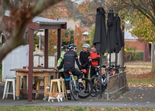 Cyclists talking at a cafe after a morning ride