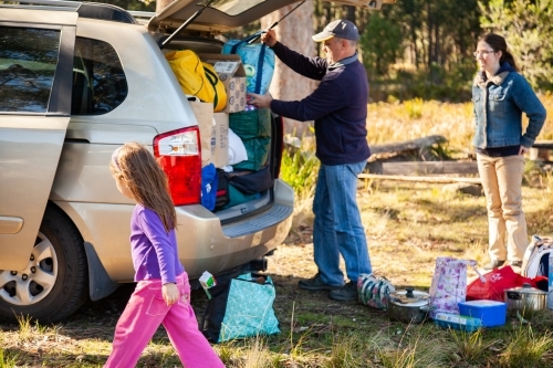 Dad packing family car for holiday trip - Australian Stock Image