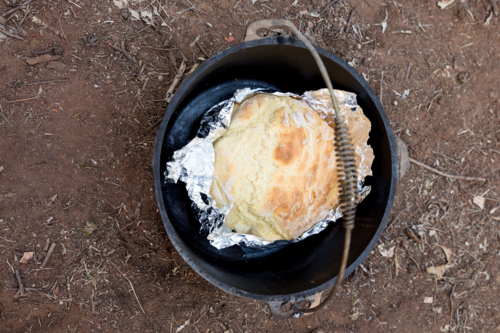 Damper in a camp oven - Australian Stock Image