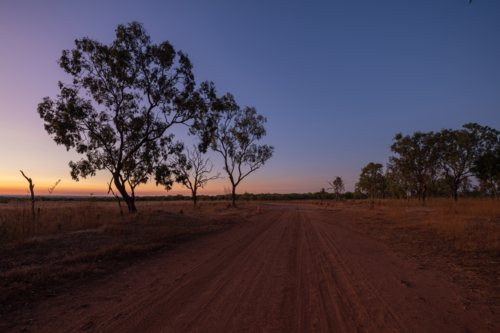 Dawn light, sunrise on the road side in NT - Australian Stock Image