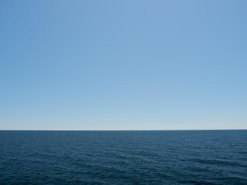 Deep blue ocean with pale blue sky - Australian Stock Image