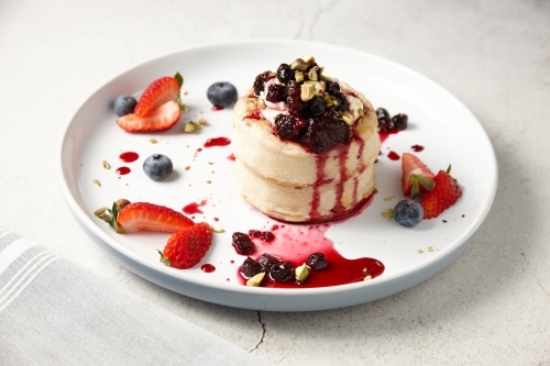 Delicious crumpets with berries and ice cream