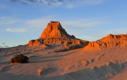 Desert landscape in outback Australia with late afternoon light casting long shadows - Australian Stock Image