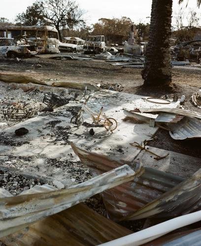 Detail of bushfire ravaged town with destroyed vehicles and buldings - Australian Stock Image