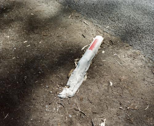 Detail of road marker melted by bushfire - Australian Stock Image