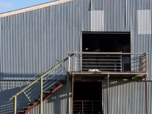 Detail of stairs to a corrugated iron shearing shed - Australian Stock Image