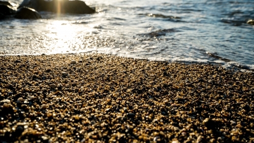 Detail of stones on pebbly ocean beach - Australian Stock Image
