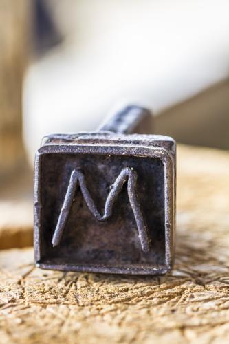 Detail shot of old metal branding iron - Australian Stock Image
