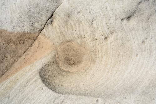Detail shot of patterned rock in creams and oranges - Australian Stock Image