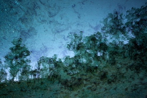Dim reflection on shallow water - Australian Stock Image