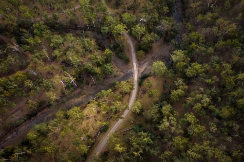 Dirt road through forest and over a creek - Australian Stock Image