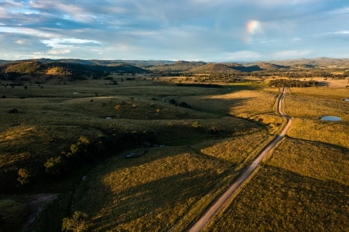 dirt road through granite belt landscape - Australian Stock Image